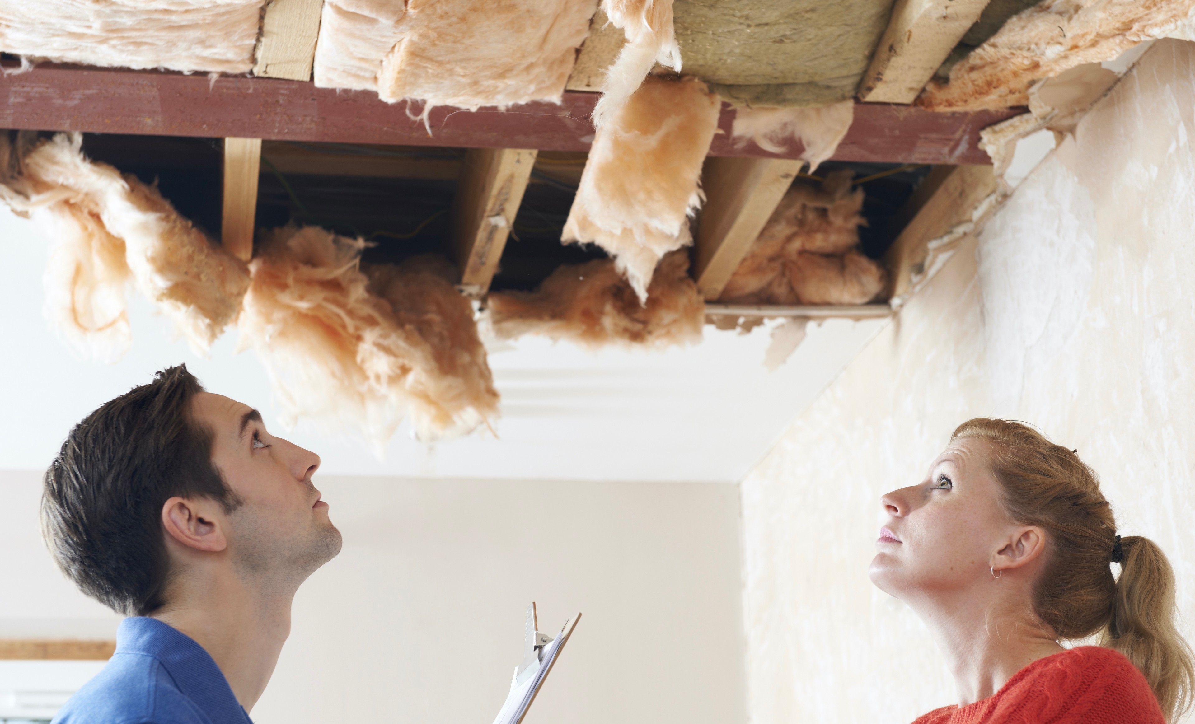 Builder,And,Client,Inspecting,Roof,Damage