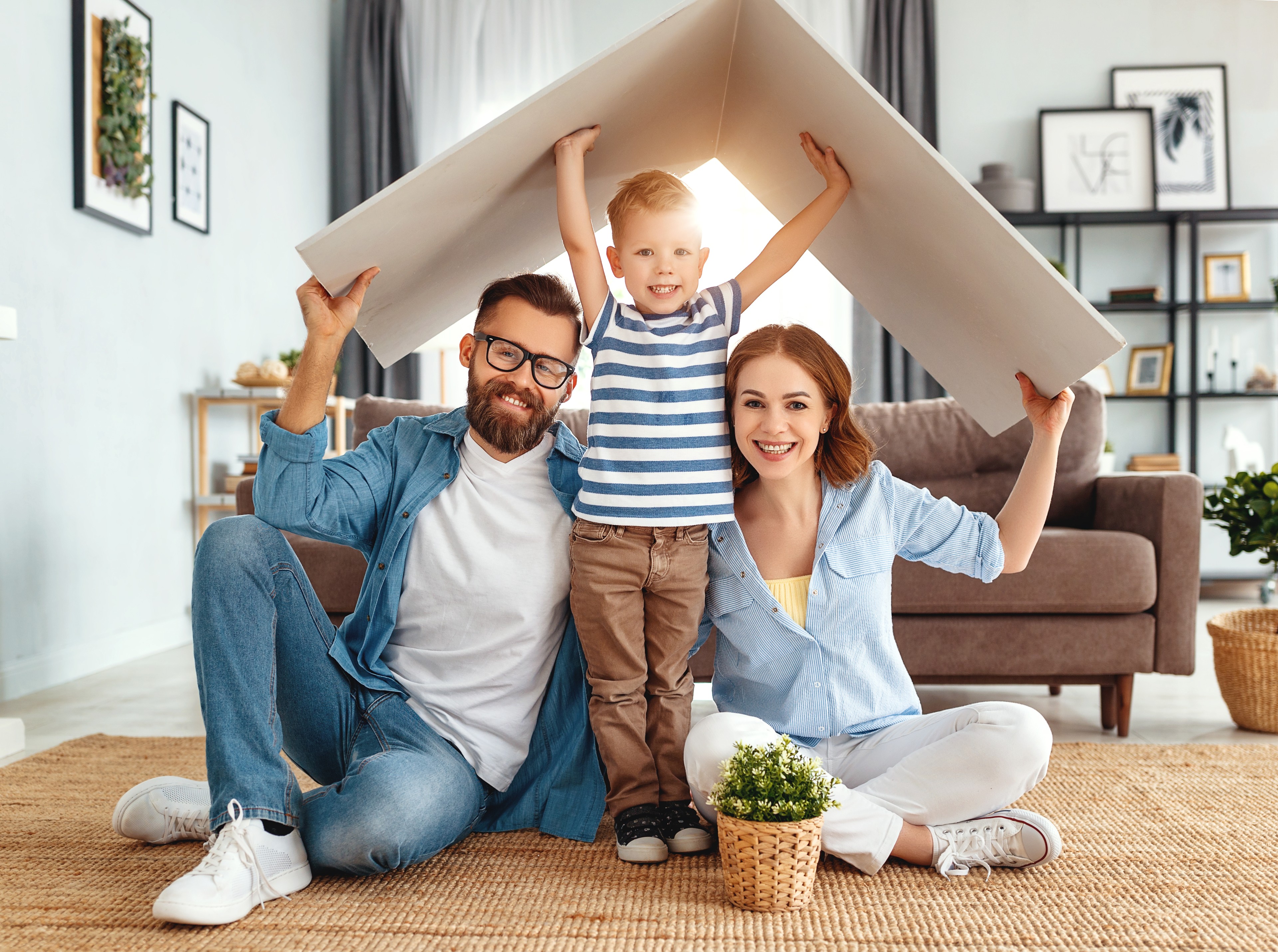 Concept,Housing,A,Young,Family.,Mother,Father,And,Child,In